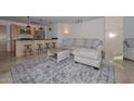 Open living space featuring a contemporary sofa and kitchen island at 4808 N 24Th St # 1123, Phoenix, AZ 85016