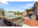 Relaxing hot tub on a patio with seating at 6752 E Las Mananitas Dr, Gold Canyon, AZ 85118