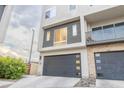 Contemporary townhouse exterior featuring a modern garage at 6850 E Mcdowell Rd # 7, Scottsdale, AZ 85257