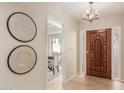 Bright and spacious entryway with decorative wall art and hardwood floors at 6945 E Glenrosa Ave, Scottsdale, AZ 85251