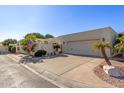 Single story home with light colored stucco and attached garage at 6945 E Glenrosa Ave, Scottsdale, AZ 85251