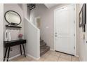 Bright entryway with staircase, mirror, and console table at 750 W Flintlock Way, Chandler, AZ 85286
