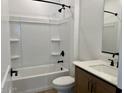 Well-lit bathroom featuring a shower over the tub and a modern vanity with a white countertop at 7638 W Rowel Rd, Peoria, AZ 85383