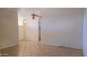 Bright living room with tile floors and a ceiling fan at 9020 E Brittle Bush Rd, Gold Canyon, AZ 85118