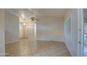 Bright living room with tile floors and ceiling fan at 9020 E Brittle Bush Rd, Gold Canyon, AZ 85118