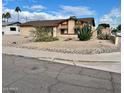 House exterior showcasing desert landscaping at 9817 N 43Rd Dr, Glendale, AZ 85302