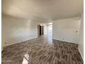 Spacious living room featuring wood-look floors at 9817 N 43Rd Dr, Glendale, AZ 85302