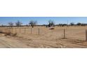 Vacant lot with chain link fencing and distant mountains at 000 W Pony Rd, Maricopa, AZ 85139