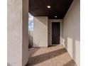 Covered entryway with modern door and brick tile flooring at 10236 E Ursula Ave, Mesa, AZ 85212