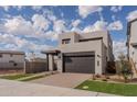 Contemporary home with a two-car garage and neat landscaping at 10236 E Ursula Ave, Mesa, AZ 85212