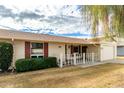 Brick ranch home with a well maintained lawn at 10343 W Prairie Hills Cir, Sun City, AZ 85351