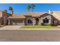 Single-story home with tile roof, attached garage, and well-manicured lawn at 16268 S 12Th Pl, Phoenix, AZ 85048