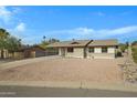 House exterior with driveway and rock landscaping at 17112 E La Pasada Dr, Fountain Hills, AZ 85268