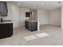 Spacious kitchen with an island and plenty of cabinet space at 1779 W Spaulding Ave, Apache Junction, AZ 85120