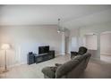 Living room featuring light floors and a ceiling fan at 19816 N 34Th Pl, Phoenix, AZ 85050