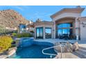 Resort-style pool and spa with a fire pit and mountain views at 24350 N Whispering Ridge Way # 50, Scottsdale, AZ 85255