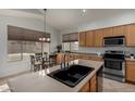 Spacious kitchen featuring stainless steel appliances and an island at 2847 E Melody Ln, Gilbert, AZ 85234