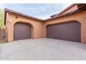 Two-car garage with attached storage space at 30213 N 124Th Ln, Peoria, AZ 85383