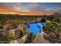 Stunning sunset view of pool and home at 30409 N 142Nd St, Scottsdale, AZ 85262