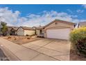 Houses with desert landscaping and a paved walkway at 3041 E Wahalla Ln, Phoenix, AZ 85050