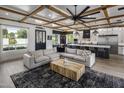 Cozy living room with an open layout, decorative ceiling, comfortable sectional, and access to the kitchen at 3322 N Valencia Ln, Phoenix, AZ 85018