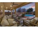 Relaxing backyard oasis with a sparkling pool and patio furniture at 3457 E Virgil Dr, Gilbert, AZ 85298