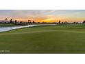 Scenic golf course with water feature at sunset at 36709 N Stoneware Dr, San Tan Valley, AZ 85140