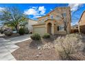 Two-story house with tan exterior, shutters, landscaping, and a two-car garage at 3743 W Wayne Ln, Anthem, AZ 85086