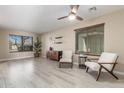 Light and airy living room with wood-look floors and comfy seating at 417 E Melanie St, San Tan Valley, AZ 85140