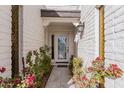 Inviting entryway with a decorative door and lush landscaping at 628 E Calavar Rd, Phoenix, AZ 85022