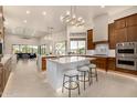 Open concept kitchen with large island, breakfast nook, and high-end finishes at 9655 N 130Th St, Scottsdale, AZ 85259