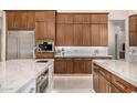 Gourmet kitchen with extensive cabinetry, quartz countertops, and high-end appliances at 9655 N 130Th St, Scottsdale, AZ 85259