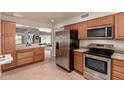 Kitchen with stainless steel appliances and wood cabinets at 10020 N 109Th Ave, Sun City, AZ 85351