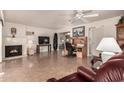 Living room with fireplace and built-in workspace at 10020 N 109Th Ave, Sun City, AZ 85351