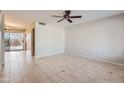 Living room with tile floors, neutral walls, and a ceiling fan at 10101 N 91St Ave # 81, Peoria, AZ 85345