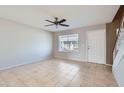 Spacious living room with tile floors and a view of the front door at 10101 N 91St Ave # 81, Peoria, AZ 85345