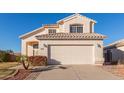 Two-story house with a two-car garage and nicely landscaped front yard at 1220 W Gail Ct, Chandler, AZ 85224