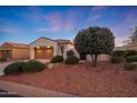 Well-maintained home with a desert landscape and two-car garage at 13129 W Junipero Dr, Sun City West, AZ 85375