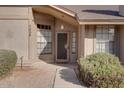 Front entrance with a security door and landscaping at 1354 E Brentrup Dr, Tempe, AZ 85283