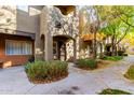 Townhome building exterior with pathway and autumn leaves at 1718 W Colter St # 193, Phoenix, AZ 85015