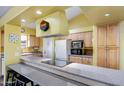 Kitchen boasts granite countertops and modern appliances at 1801 E Aire Libre Ave, Phoenix, AZ 85022