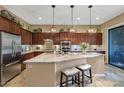 Gourmet kitchen featuring granite countertops and ample cabinetry at 19550 N Grayhawk Dr # 1107, Scottsdale, AZ 85255