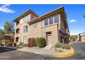 Tan building exterior with multiple entrances and landscaping at 19777 N 76Th St # 2292, Scottsdale, AZ 85255