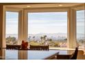 Bright dining area with large windows offering stunning city views at 2235 E Vista Ave, Phoenix, AZ 85020