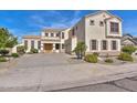 Two-story house with a large driveway and landscaping at 22830 N 32Nd Ln, Phoenix, AZ 85027