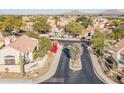 Aerial view of Los Portones community, showing homes, pool, and landscaping at 23570 N 75Th N St, Scottsdale, AZ 85255