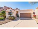 Charming house exterior with a two-car garage at 23570 N 75Th N St, Scottsdale, AZ 85255