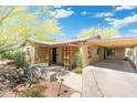 Charming one-story home with a carport and desert landscaping at 2434 E Pinchot Ave, Phoenix, AZ 85016