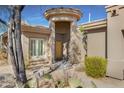 Front entrance of a single-story home with a covered entryway at 33108 N 72Nd Way, Scottsdale, AZ 85266