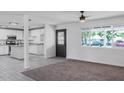 Modern kitchen featuring white cabinets, granite countertops, and an island at 3426 W Elm St, Phoenix, AZ 85017